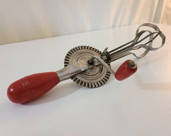 30's 40's manual egg beater hand mixer red wood handles primitive rustic for kitchen use or decor original handles prop for TV, movies