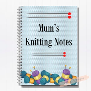 May include: A blue and white spiral bound notebook with the text "Mum's Knitting Notes" on the cover. The cover has a knitted fabric pattern and two knitting needles with red tips. There are also colourful yarn balls and knitting needles at the bottom of the cover.