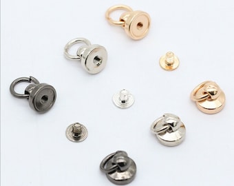 May include: Assortment of metal ring and screw-on closures in silver, gold, and black finishes. These closures are ideal for bags, purses, and other leather goods.