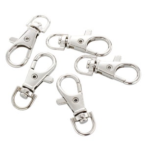 May include: Five silver-toned metal key chain clips with a swivel hook and a spring-loaded clasp.