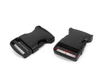 May include: Two black plastic side release buckles, each measuring 2.5 cm in length. The buckles are commonly used for straps, bags, and other DIY projects.