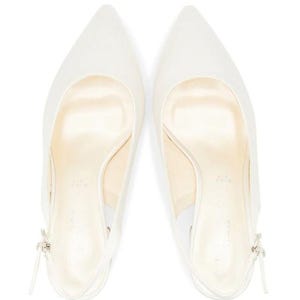 May include: A pair of white satin slingback heels with a pointed toe.