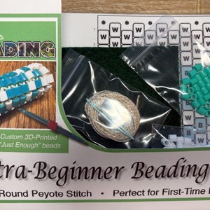 May include: An Ultra-Beginner Beading Kit for basic round peyote stitch, featuring a printed pattern, a 3D-printed needle, beige thread, and small bags of white and turquoise beads. The kit includes a visual guide showing a finished bead tube.