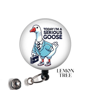 May include: A white goose wearing a blue suit and tie, holding a briefcase. The goose is standing on a white background with the text "Today I'm a Serious Goose".