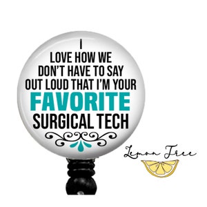 May include: White badge reel with a black and teal design. The text on the badge reel reads "I love how we don't have to say out loud that I'm your favorite surgical tech".