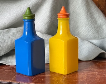 Vintage Gemco Colored Glass Oil and Vinegar Cruets Orange Yellow Blue and Green with Enameled Metal Screw On Lids GC958