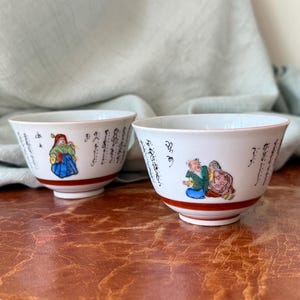 Vintage Japanese Kutani Teacups Set of 2 Handpainted Illustrations and Calligraphy Designs Circa 1960’s PC3981