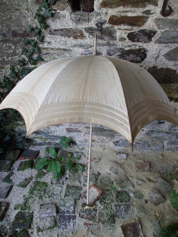 Antique parasol. Vintage parasol. Re-enactment. Co