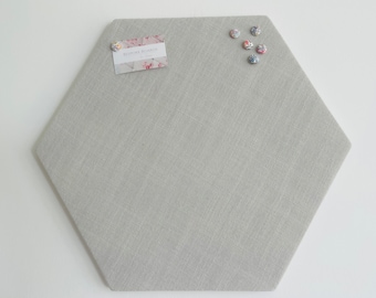 Hexagon shaped grey fabric covered cork board / pin board