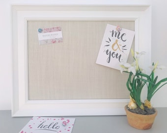 White framed oyster off white  fabric covered notice board / pin board