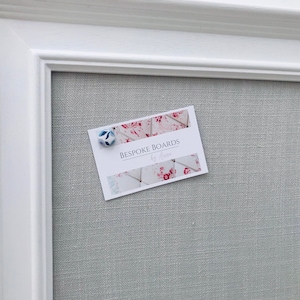White framed soft grey fabric covered notice board / pin board