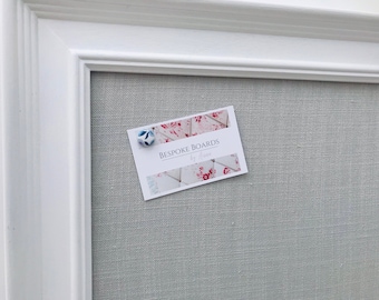 White framed soft grey fabric covered notice board / pin board