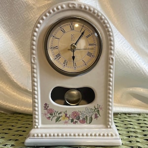 May include: A rustic wooden sign with the text "Welcome to our home" in white lettering. The sign features a distressed finish and a simple, inviting design, perfect for front door decor.