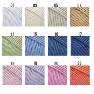 May include: A color chart of yarn samples in various shades of white, beige, green, blue, pink, and orange. The samples are labeled with numbers 01, 03, 05, 07, 11, 15, 16, 17, 18, 19, 20, and 23.