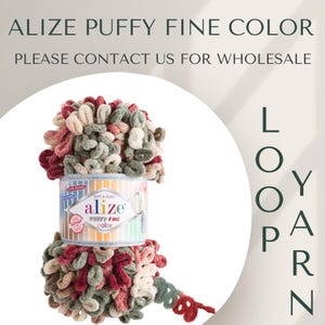 May include: A skein of Alize Puffy Fine Color yarn in a mix of red, green, and beige. The yarn is soft and fluffy, and it is perfect for making cozy blankets, scarves, and hats. The label reads "Soft & Quick Alize Puffy Fine Color".