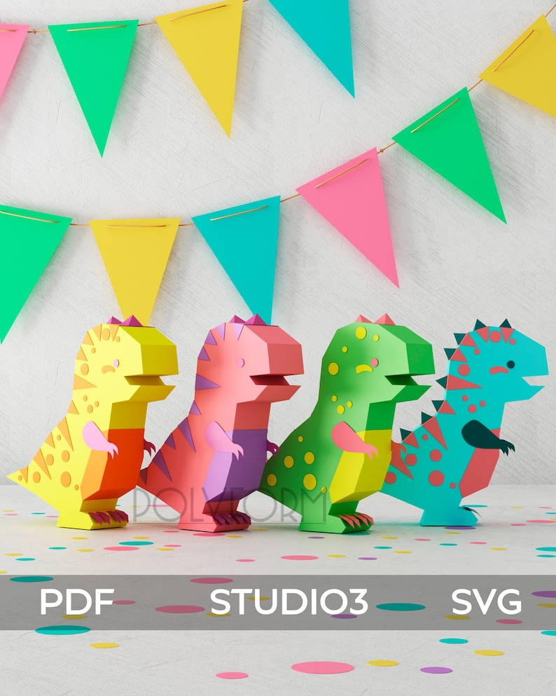 May include: Four colorful papercraft dinosaurs in a row on a white surface with confetti. The dinosaurs are yellow, pink, green, and blue. The dinosaurs are all facing the right. The dinosaurs are all standing on a white surface with confetti.