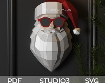May include: A geometric Santa Claus head with a red hat and sunglasses is mounted on a dark wall. The Santa figure is primarily white and gray, with a red hat and sunglasses. The image includes the text "PDF", "STUDIO3", and "SVG".