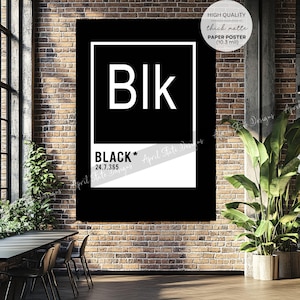 May include: A black and white poster with the word "Blk" in a white square on a black background. The text "BLACK* 24.7.365" is below the square. The poster is hanging on a brick wall.