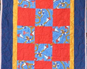 Nautical-themed small quilt in primary colors, handmade