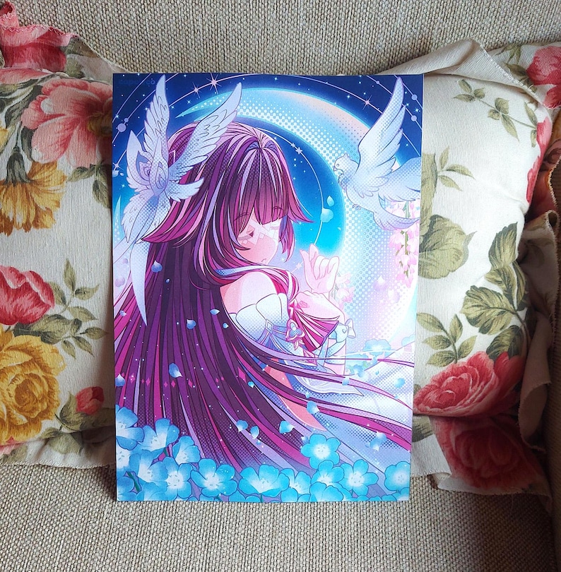 May include: A vibrant art print featuring a manga-style illustration of a person with long, flowing purple hair and a white dress. Two white doves and blue flowers surround the figure, set against a backdrop of a rainbow and stars. The artwork has a dreamy, ethereal quality.