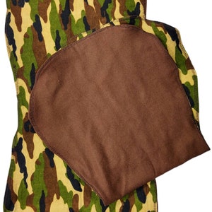 May include: Two cloth pads. The bottom pad features a camouflage pattern in shades of green, brown, and tan. The top pad is a solid brown color. Both pads have a stitched edge.