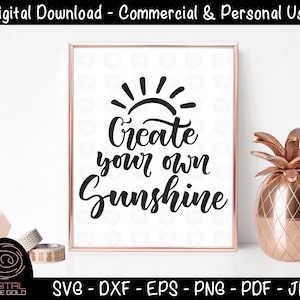 Peut inclure: Une impression encadrée blanche avec un graphique de soleil noir et le texte "Créez votre propre soleil".