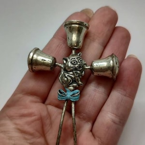 Antique 800 solid silver rattling baby toy with enameled cat design