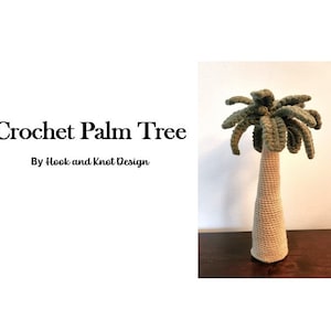 May include: A crocheted palm tree with a tan trunk and green fronds. The text "Crochet Palm Tree By Hook and Knot Design" is displayed on a white background. The tree is displayed on a dark brown surface.