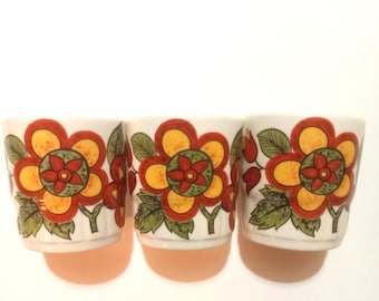 egg cups set of three vintage 1970s flower pattern orange and red