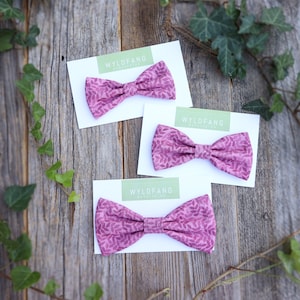 Pink dog bow tie made of cotton fabric with floral print for attachment to your dog collar