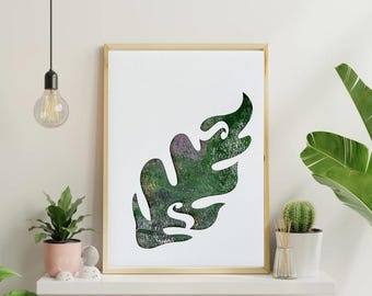 May include: A framed print with a white background and a green leaf silhouette. The leaf is filled with a textured pattern of green, pink, and white.