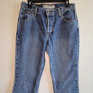 Vintage damesjeans jaren 90 knoop vlieg American Eagle wijd uitlopende pijpen blauw denim, maat 8 hoge zakken riemlussen jaren 90 dameskleding