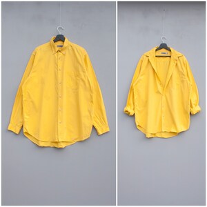 bright yellow button down shirt