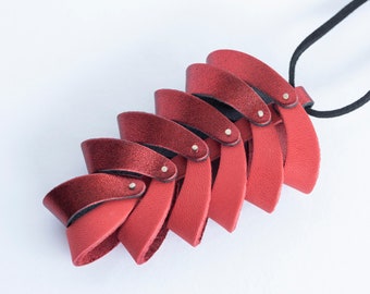 Red contemporary leather pendant, Kinetic pinecone, 3D statement piece, Matte and metallic, Long adorable & easy wear