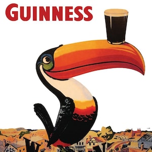 May include: Vintage Guinness advertisement featuring a toucan with a pint of Guinness on its beak. The toucan is perched on a compass rose, with the text "Lovely day for a Guinness" in red. The background depicts a quaint village.