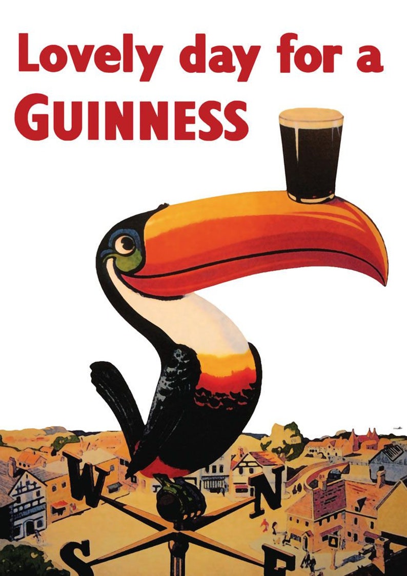 May include: Vintage Guinness advertisement featuring a toucan with a pint of Guinness on its beak. The toucan is perched on a compass rose, with the text "Lovely day for a Guinness" in red. The background depicts a quaint village.