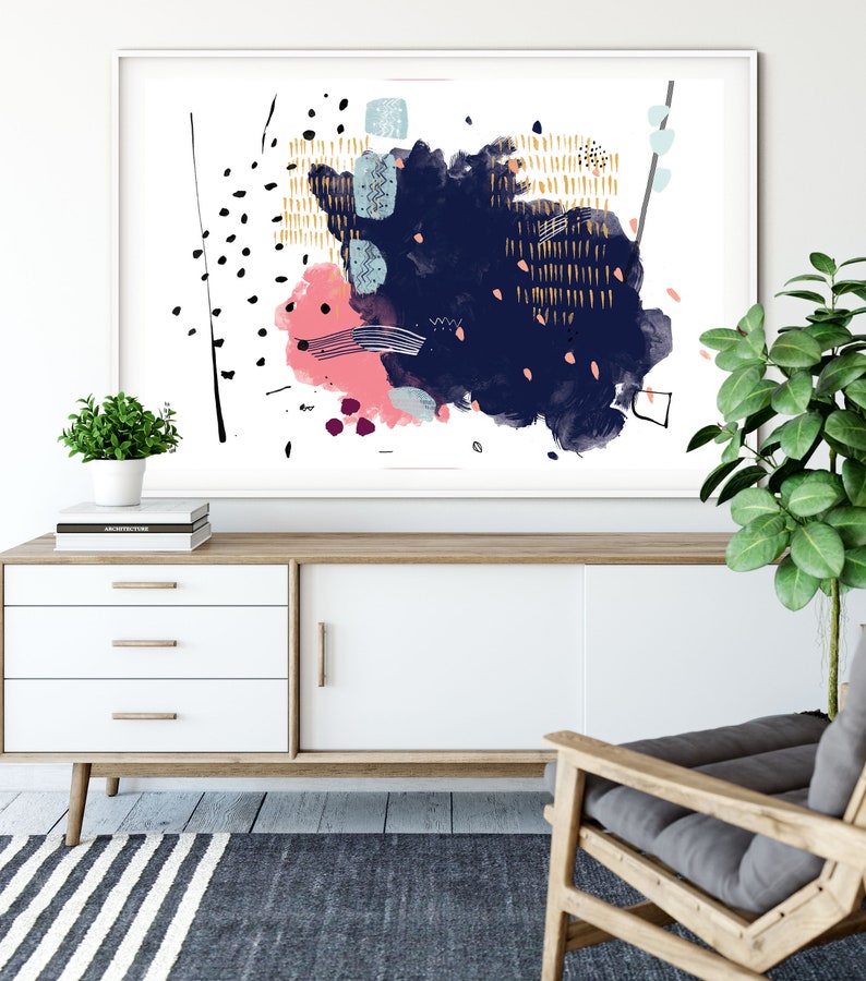 May include: Abstract art print with a white background and a large blue and pink watercolour splatter. The splatter has gold and black accents and geometric shapes.