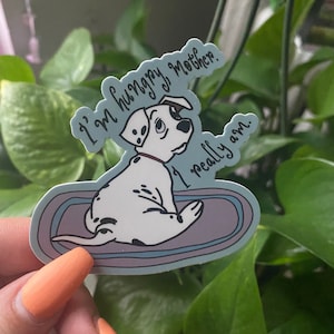 May include: A sticker featuring a cartoon Dalmatian puppy lying on a blue and purple rug. The puppy is looking to the right and has a black collar. The text "I'm hungry, mother. I really am." is written in white cursive.