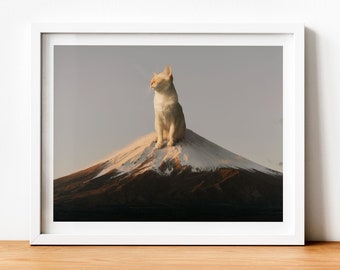 May include: A white cat sits atop a snow-capped mountain, with a serene expression. The mountain is a majestic peak, with a backdrop of a soft, light blue sky.