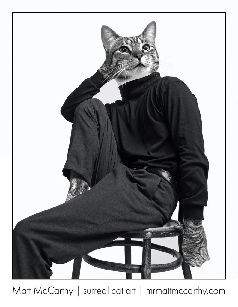 May include: A black and white photograph of a cat wearing a black turtleneck and trousers, sitting on a wooden stool. The cat is looking up and to the right. The photo is titled "Matt McCarthy | surreal cat art | mrmattmccarthy.com".