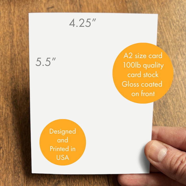 May include: A white card with yellow circles containing text. The card measures 5.5 inches by 4.25 inches. The text on the card reads "A2 size card 100lb quality card stock Gloss coated on front" and "Designed and Printed in USA".