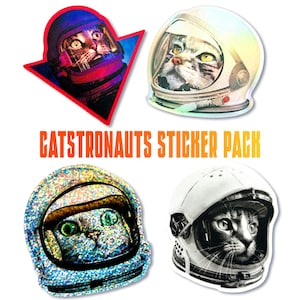 May include: A sticker pack featuring four cat illustrations wearing astronaut helmets. The text "CATSTRONAUTS STICKER PACK" is displayed in orange. The cat illustrations have different helmet designs and colors, including a red and blue design.