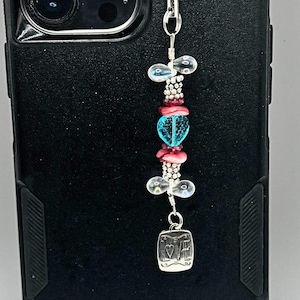 Espelho retrovisor, telefone ou bolsa pendurados