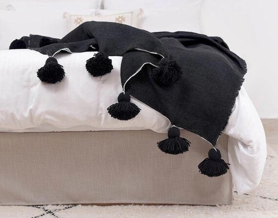 Black throw with pom poms sale
