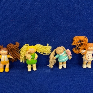 Vintage lot of 4 Cabbage Patch Doll Figurines
