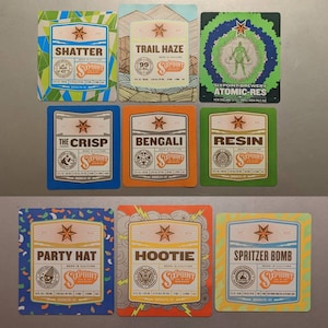 May include: Nine colorful beer bottle labels with different designs and names. The labels feature a star, a six-pointed star logo, and the text "Sixpoint Brewery".