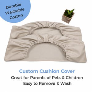 May include: Beige custom cushion cover made of durable, washable cotton. The cover is designed for parents of pets and children and is easy to remove and wash. The text "Custom Cushion Cover" is displayed in blue.