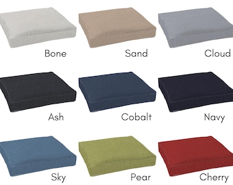 May include: Nine square seat cushions in various colors, including Bone, Sand, Cloud, Ash, Cobalt, Navy, Sky, Pear, and Cherry. Each cushion has a textured surface and is labeled with its color name. The cushions are arranged in a three-by-three grid.