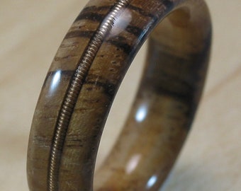 Zebrawood ring with guitar string inlay