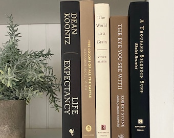 Modern Bookshelf Decor: neutral book decor, hardcover books in black tan cream white, decorative book for minimalist home office or library